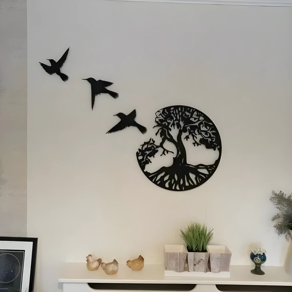 Black iron wind chime wall art hanging on a wall in a modern simple style.