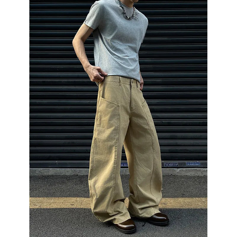 Men's khaki coloured straight-leg cotton casual trousers laid flat, showcasing the retro style and solid colour.