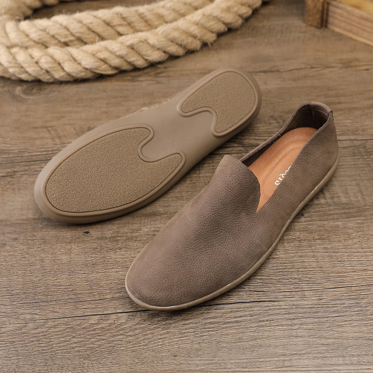 Handmade grey men's casual shoes with a wedge heel and leather upper.