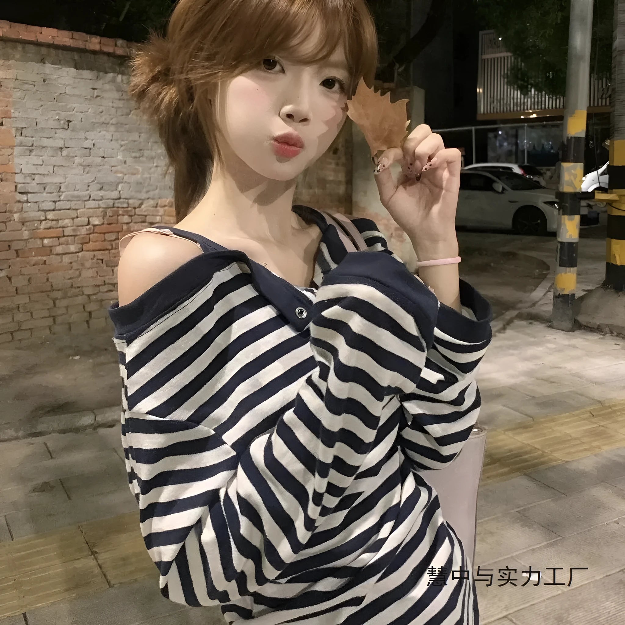 Dark blue Korean-style oversized women's long-sleeved T-shirt with embroidery, stripes, and button details on a soft viscose fabric.