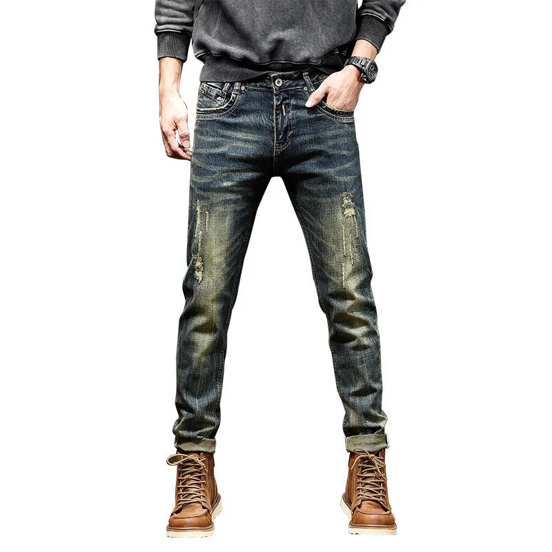 Men's skinny fit stretch jeans in a retro colour, showing zip fly and slim leg cut.