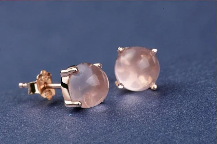 Rose gold coloured drop shaped stud earrings with synthetic ross quartz crystal inlay, Korean style design