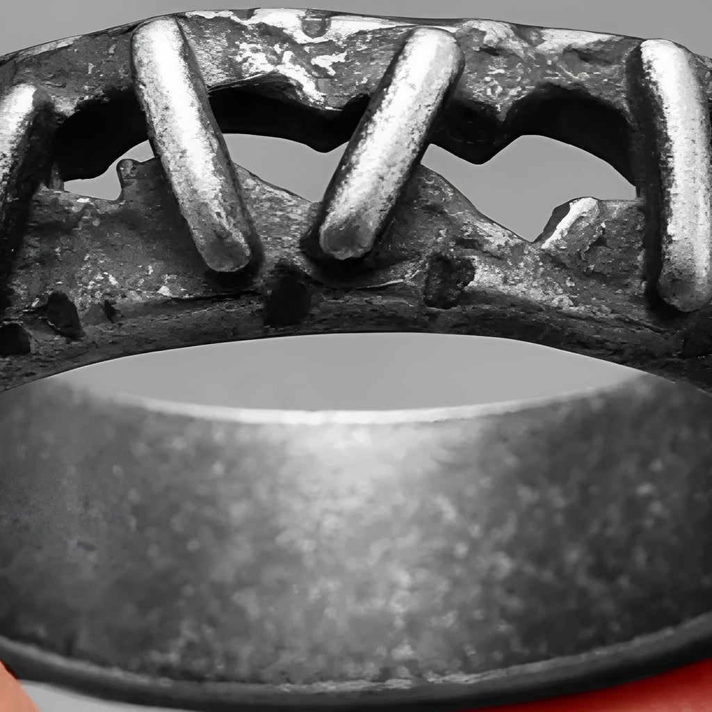 Stainless steel double ring with dark punk stitching detail, showing the layered band design.