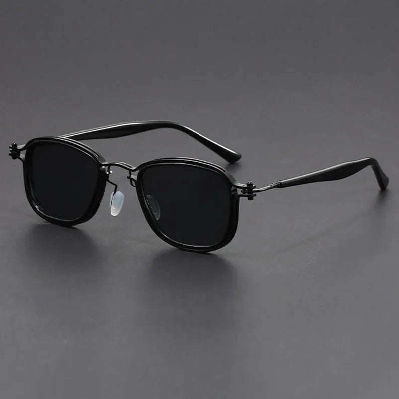 Retro style square sunglasses with a mixed metal and plastic frame and AC lenses.