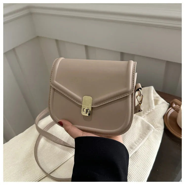 Soft PU leather horizontal square messenger bag with clamshell opening in khaki colour.