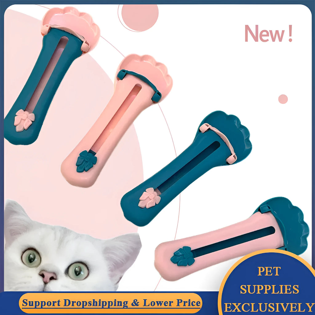 Green and pink pet food scooper spoon with squeezer handle and extruded feeder tip for dispensing treats.