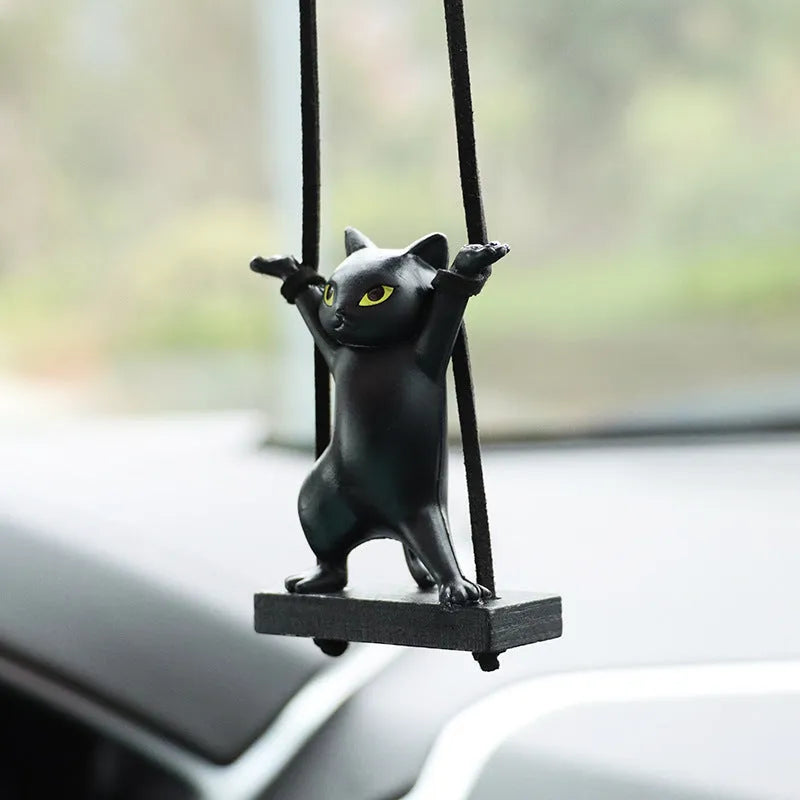 Resin cartoon cat pendant for car interior decoration on adjustable rope.