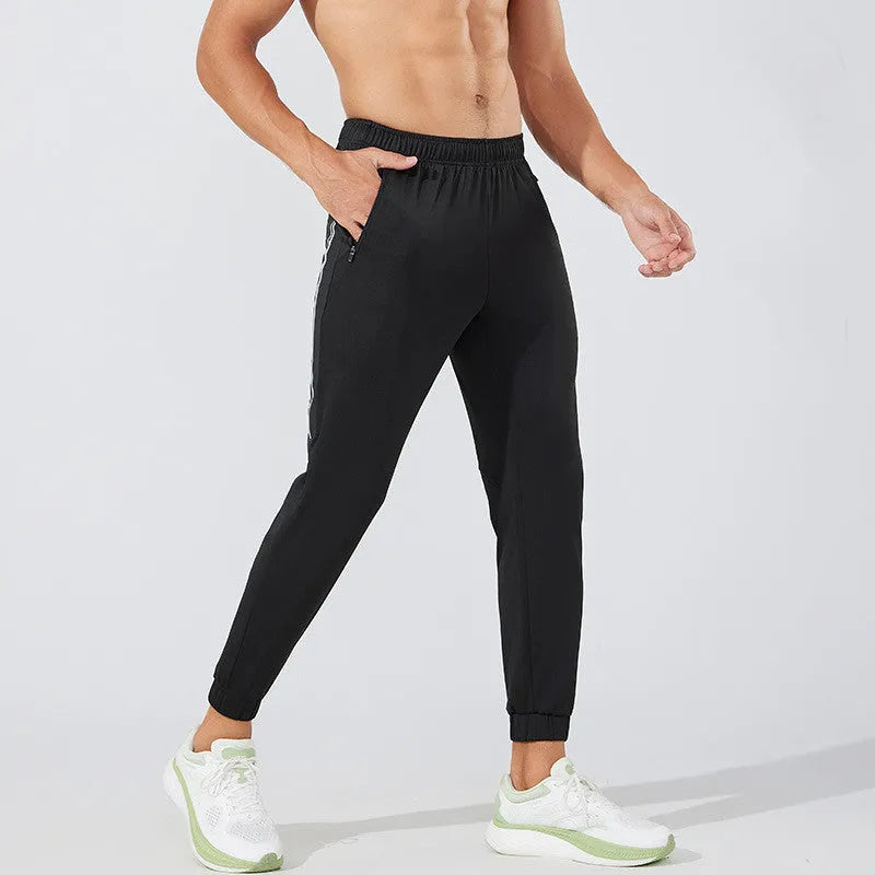 Men's black running trousers with mid-waist design and full-length athletic cut