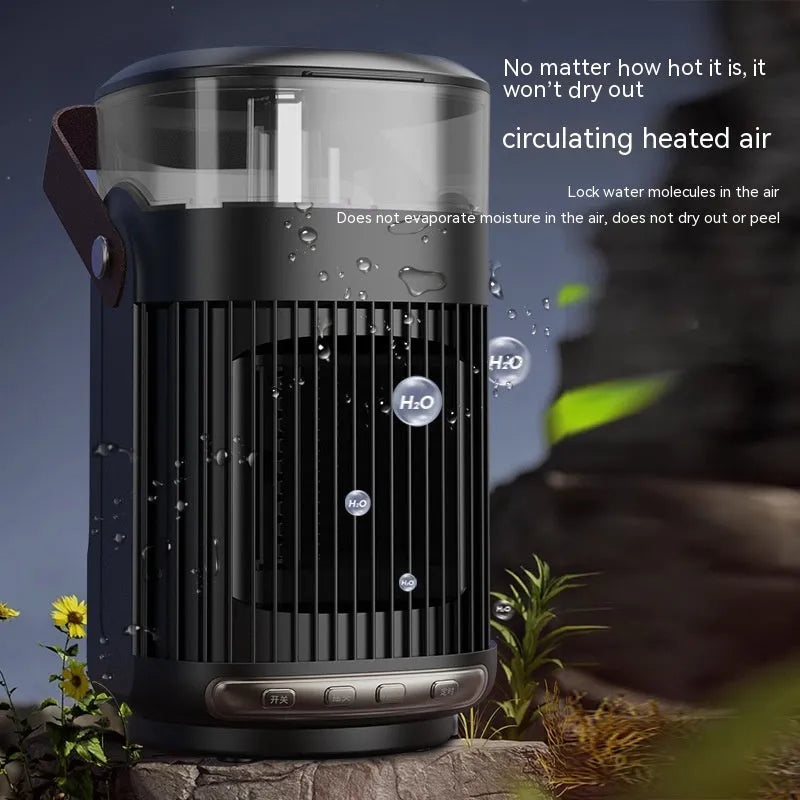 Black portable PTC space heater with built-in humidifier unit on a desk
