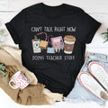 Black loose fit cotton summer t-shirt for men and women on a hanger.