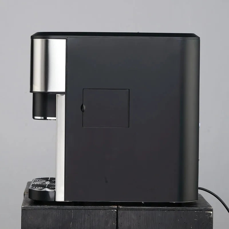 Black desktop ice maker with stainless steel ice box showing ice crushing and cold water functions