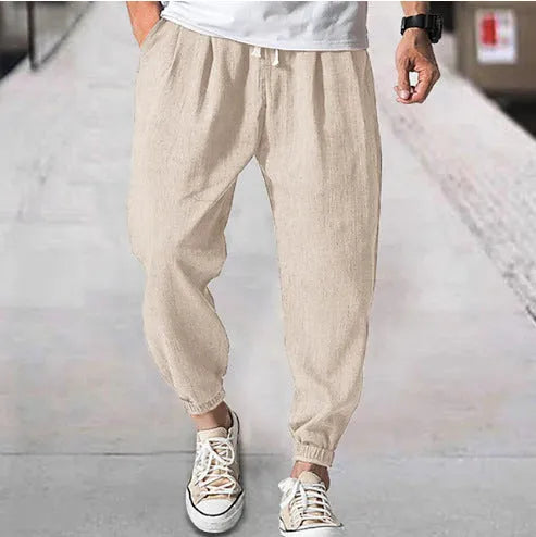 Men's casual cotton trousers with banded ankles in light green colour showing loose fit summer style
