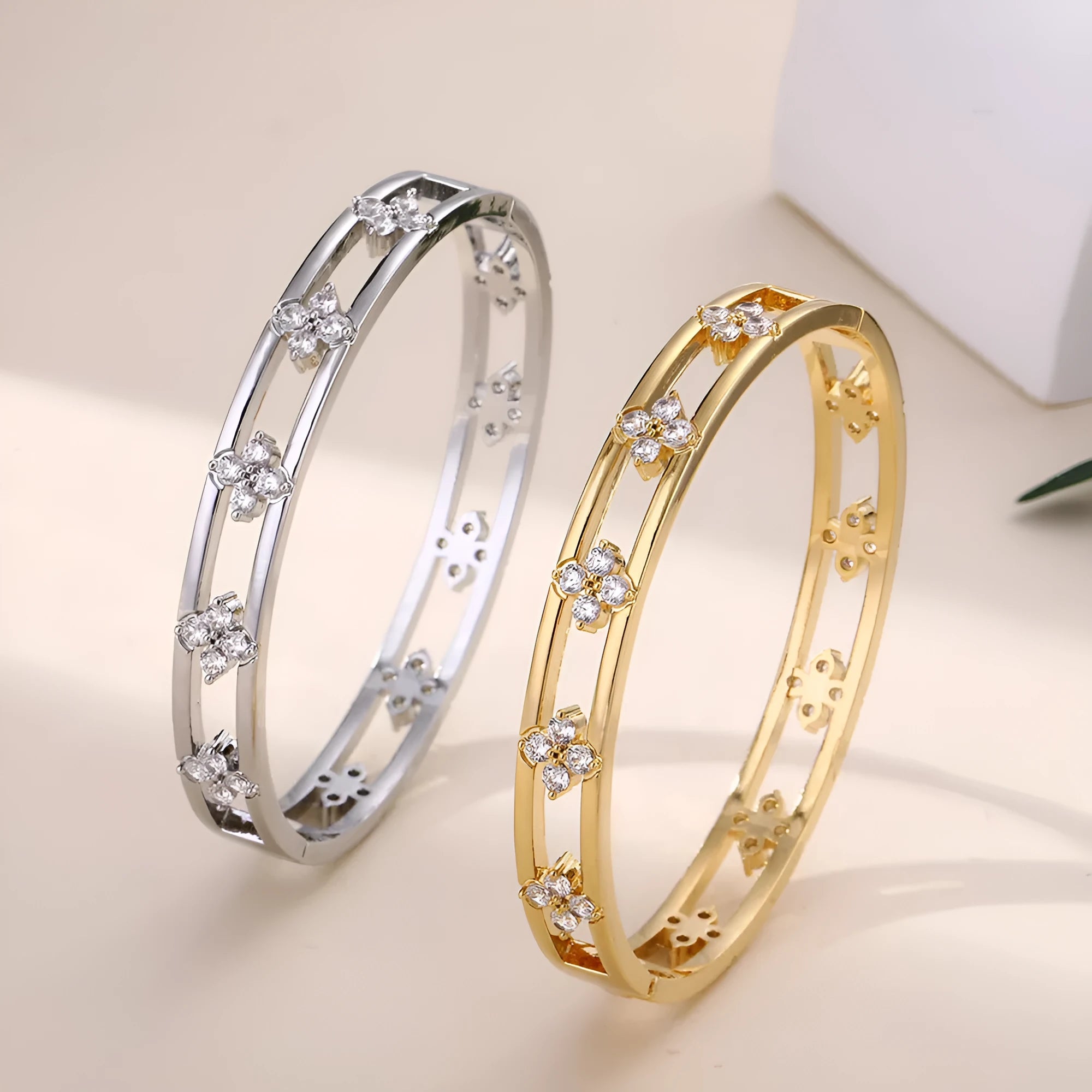 Gold or silver hollow women's bracelet with four-leaf clover design and zircon crystals