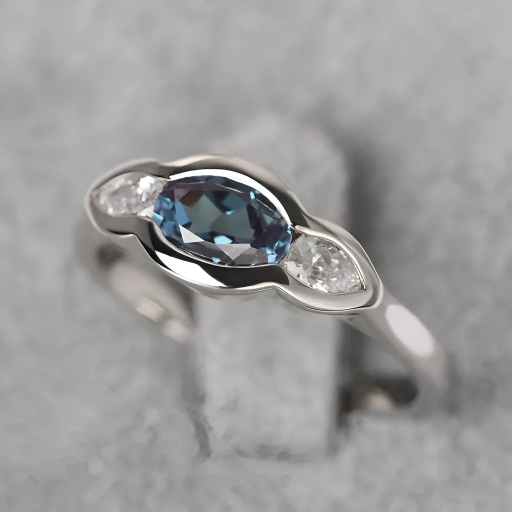 Women's geometric ellipse copper ring with white gold finish and inlaid zircon stones.