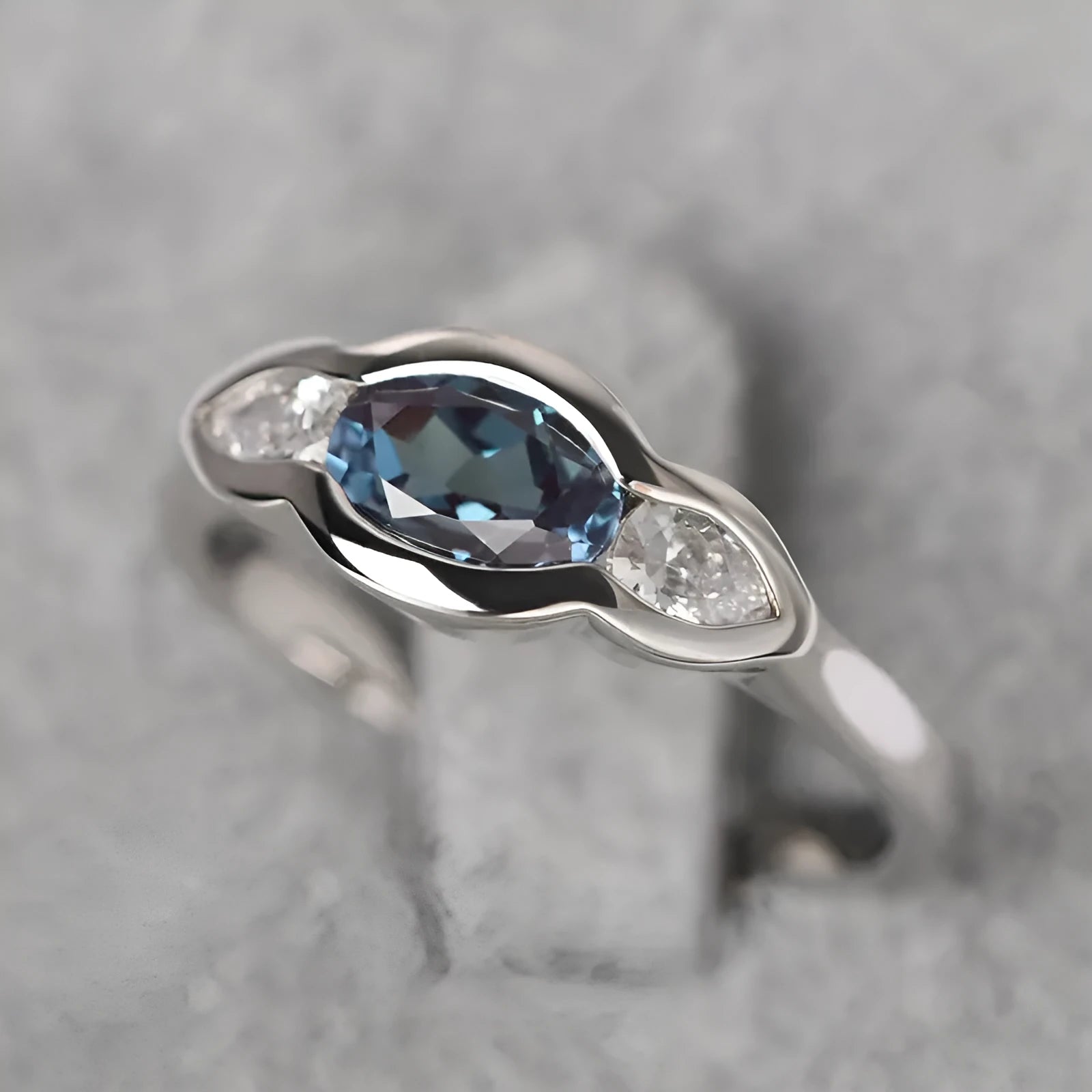 Women's geometric ellipse copper ring with white gold finish and inlaid zircon stones.