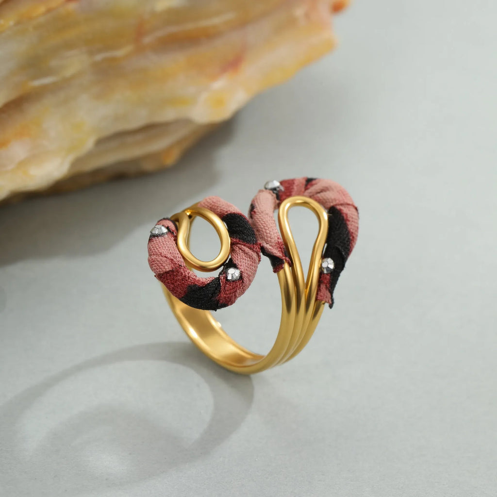 Stainless steel open mouth ring with leopard print in geometric shape on a hand.