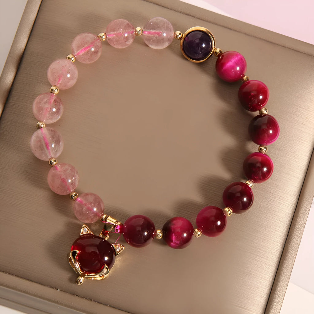 Strawberry crystal bracelet with elastic rope on wrist showing 18cm circumference