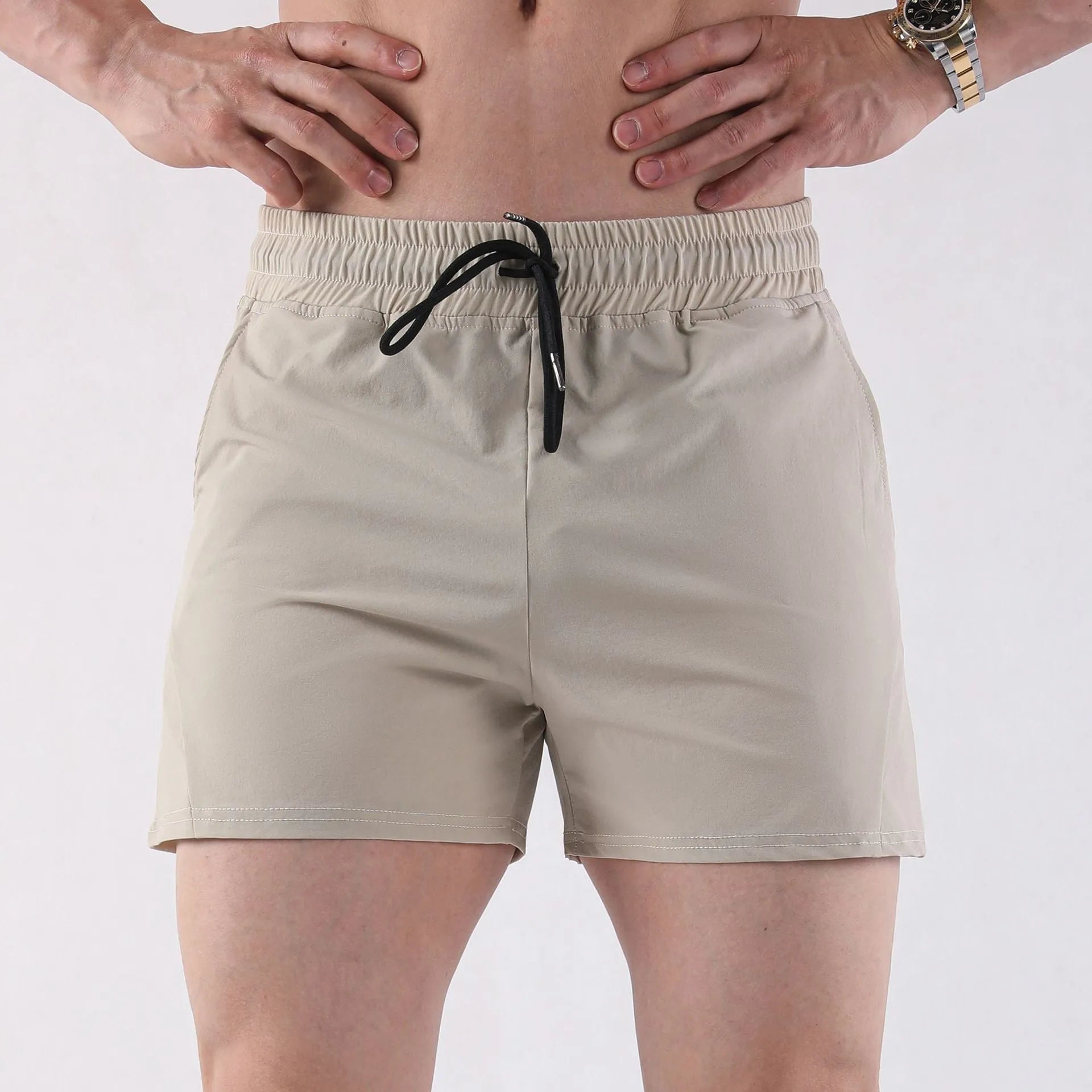 Men's lightweight polyester basketball shorts in grey, black, apricot, or green.
