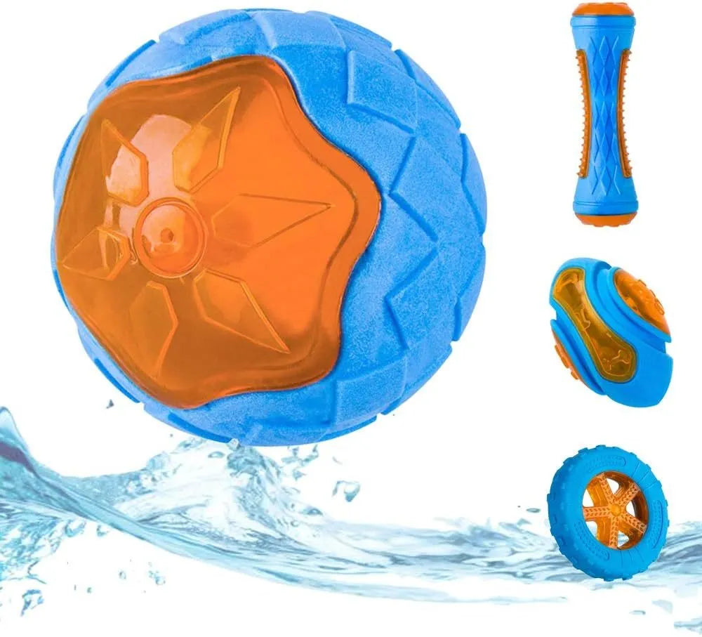 Set of three TPR dog toys: a blue squeaky ball, an orange barbell, and red tyres on grass.