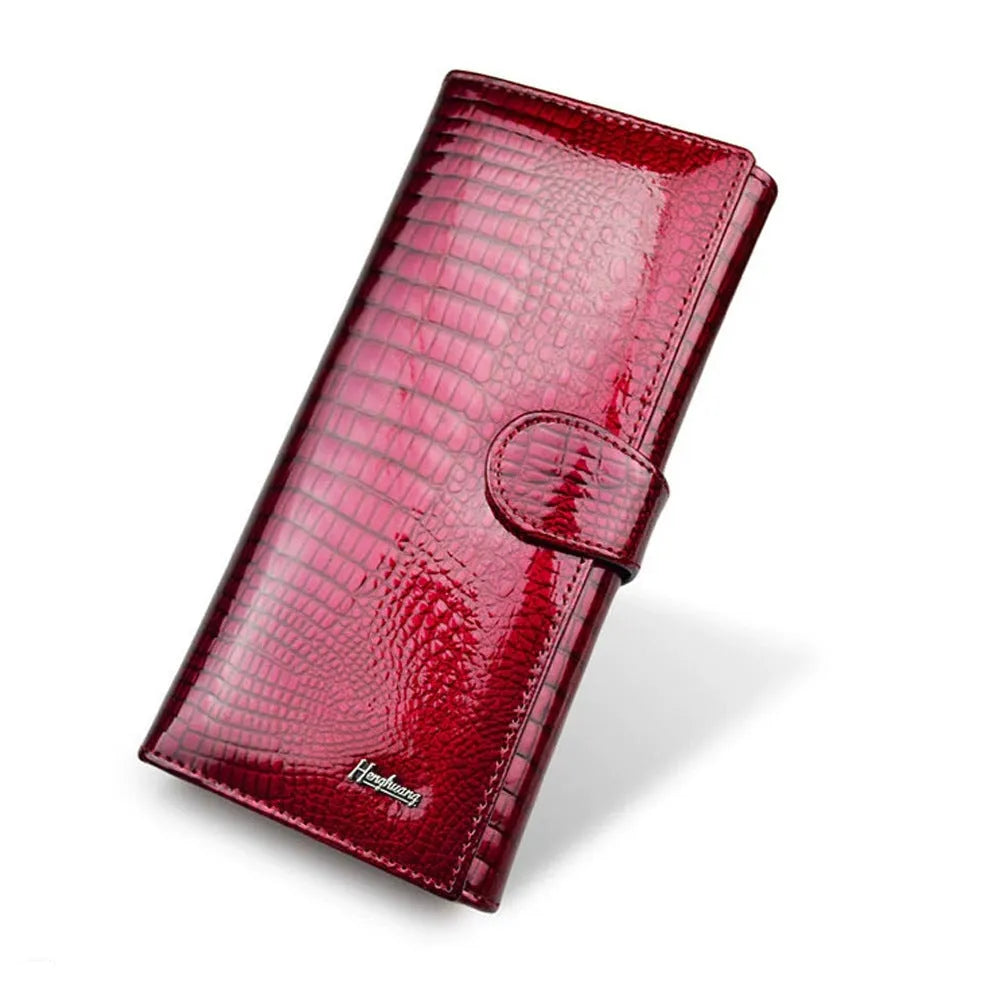 Genuine leather coin purse with patent finish and crocodile pattern in wine red colour