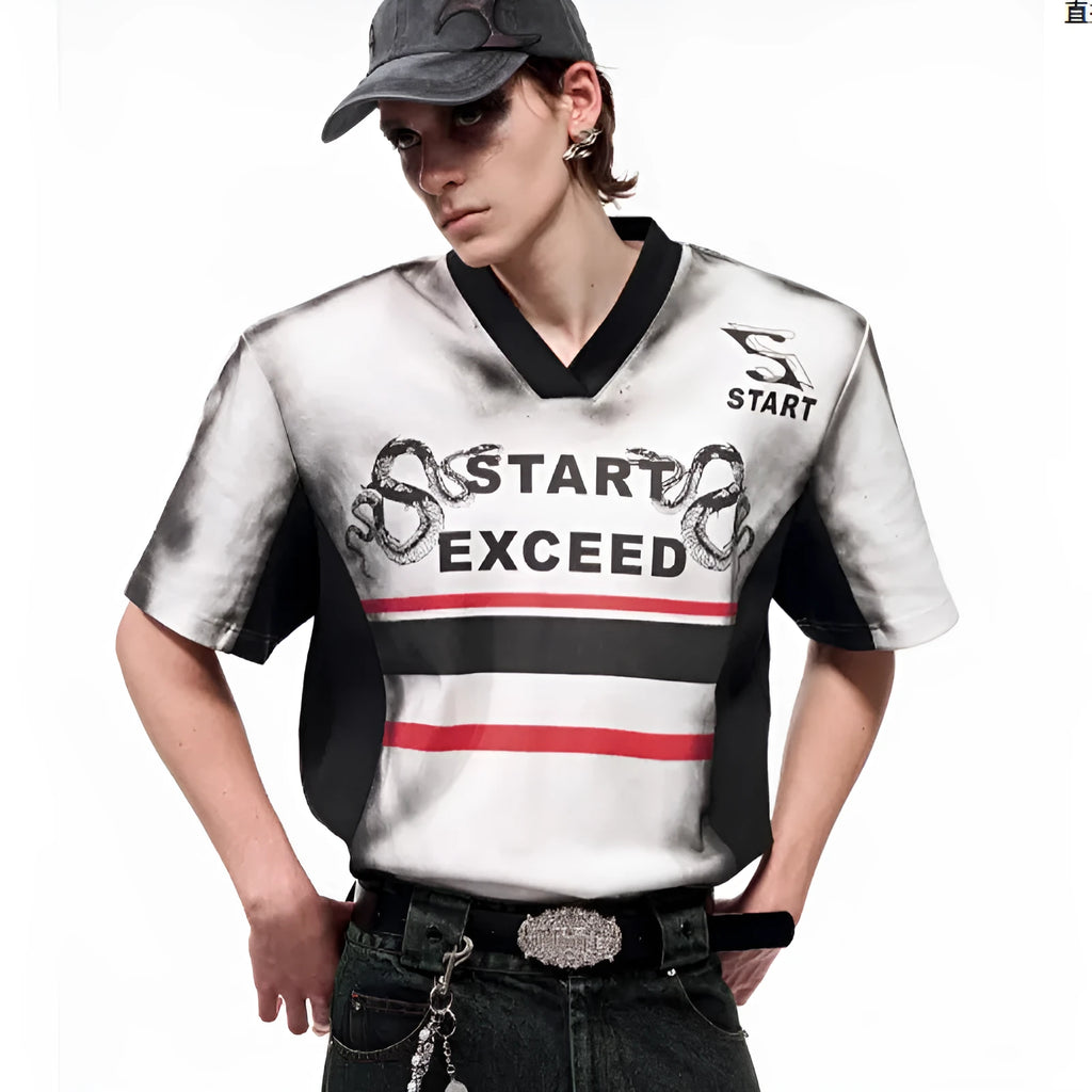 Women's V-neck short sleeve top with a black and white letter snake pattern print and padded shoulders.