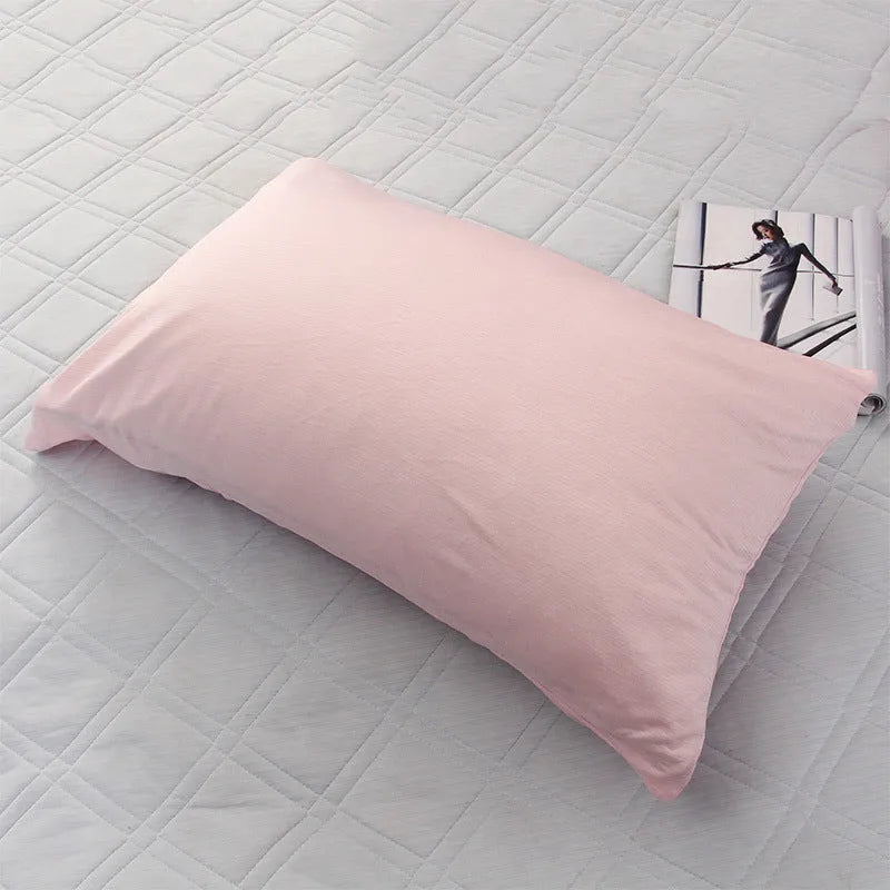 Blue and grey cooling blanket with Japanese Q-Max fibres on a bed.