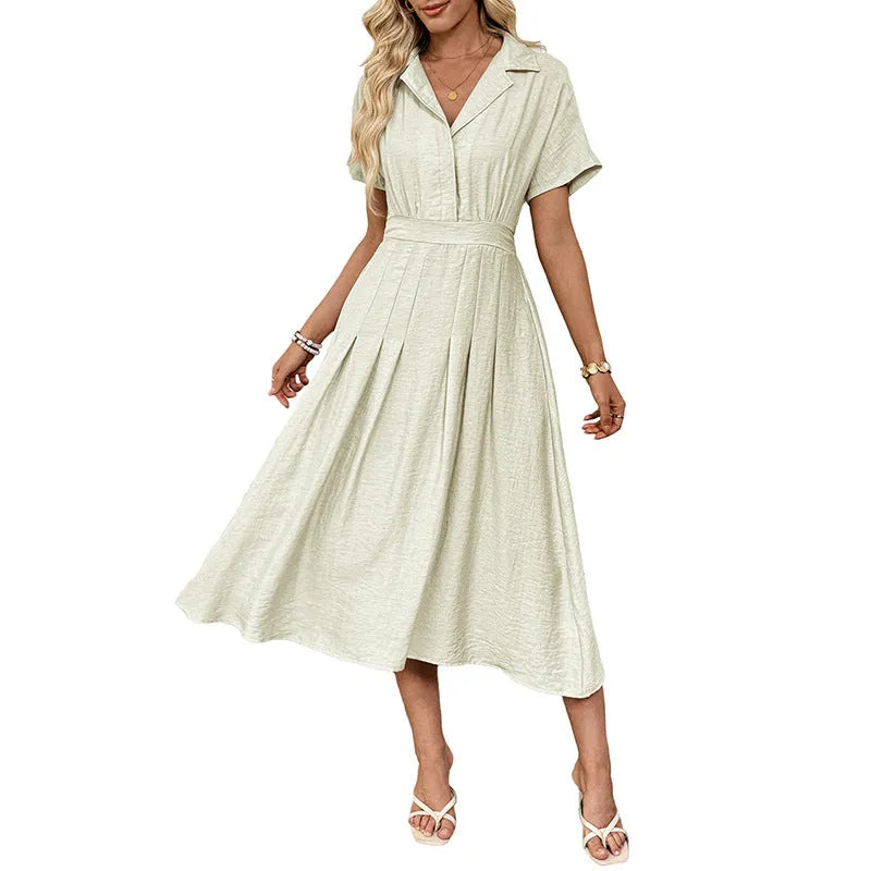 Light green women's shirtdress with lapel collar, waist tie, and side pockets.
