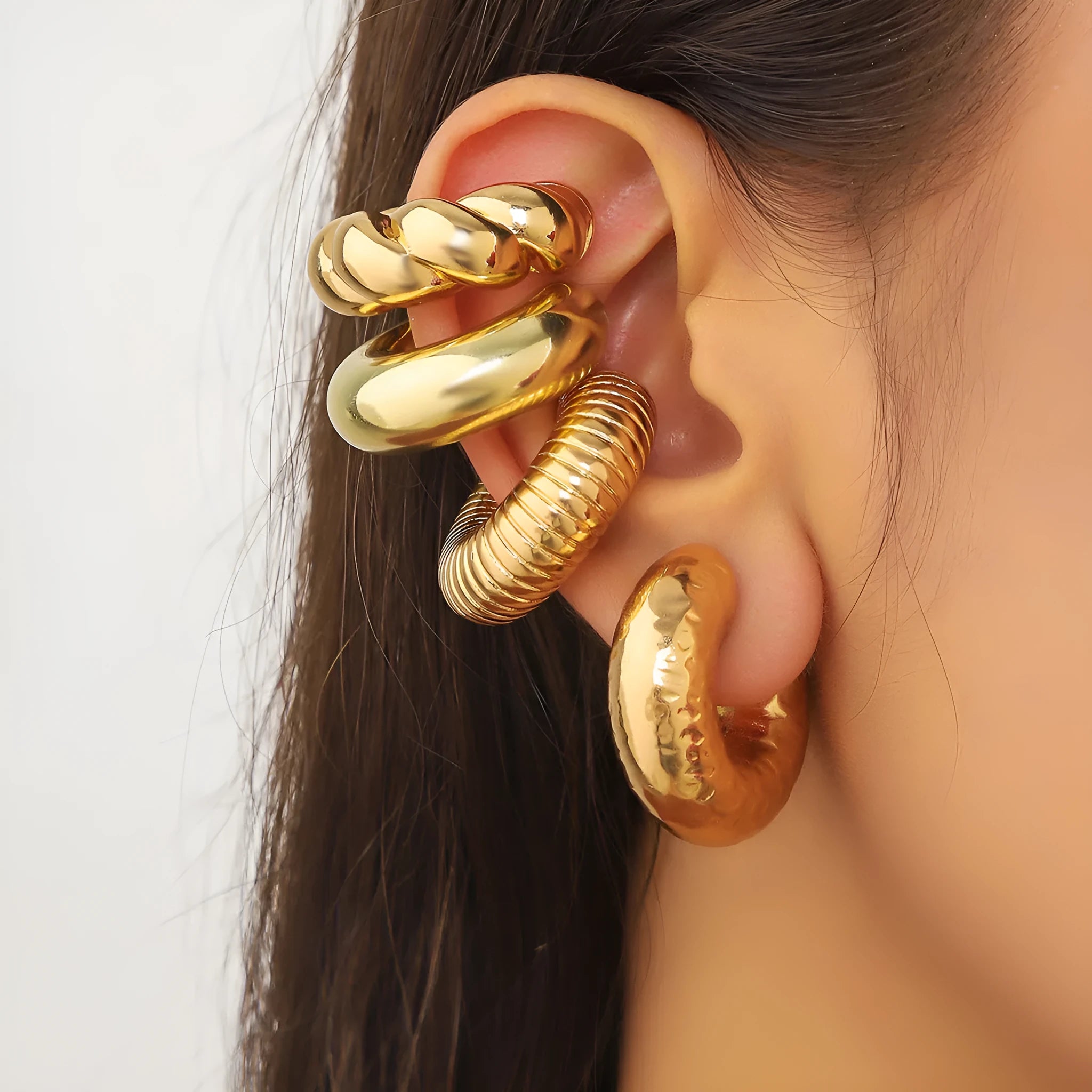 Set of four geometric clip-on earrings for women in gold and silver colours