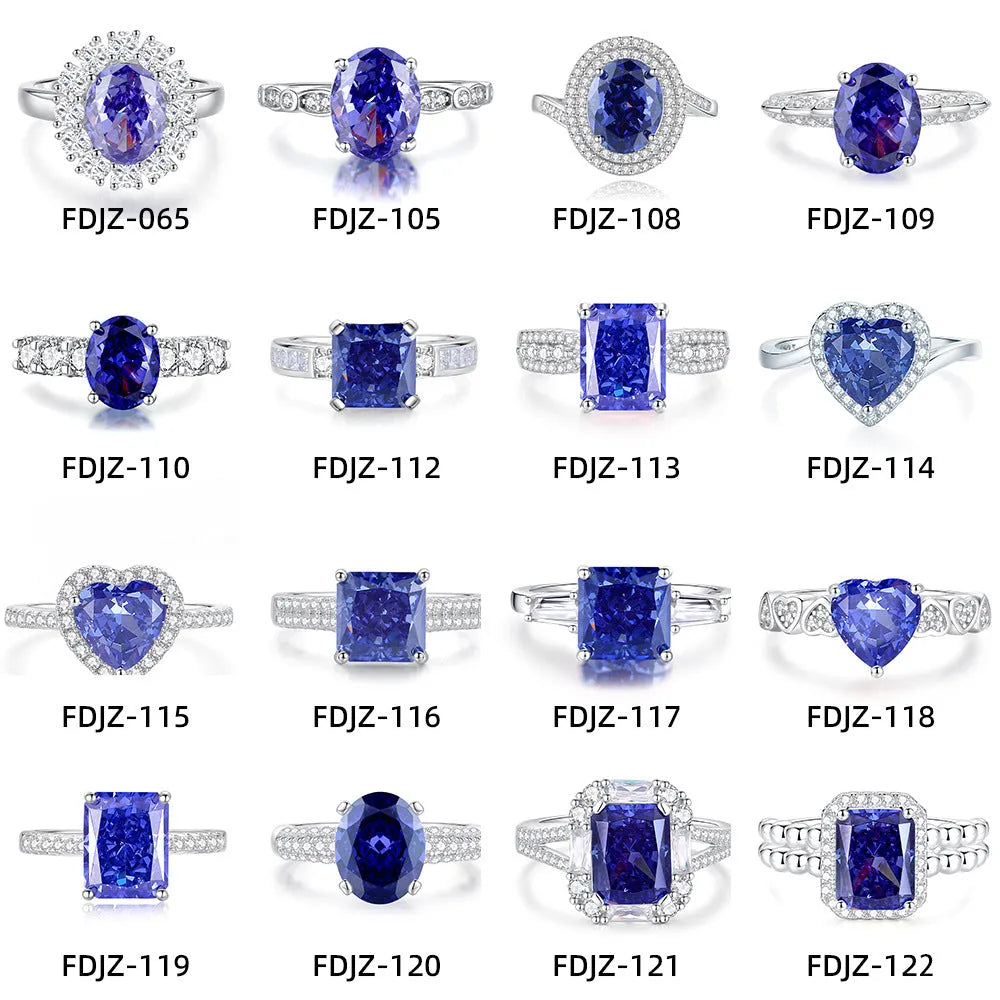 Women's heart-shaped sterling silver ring with ice flower cut coloured zircon stone on finger.
