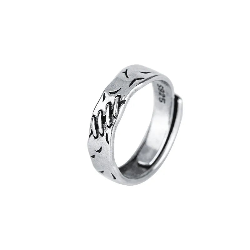 Geometric copper adjustable ring with black finish and round oval design elements