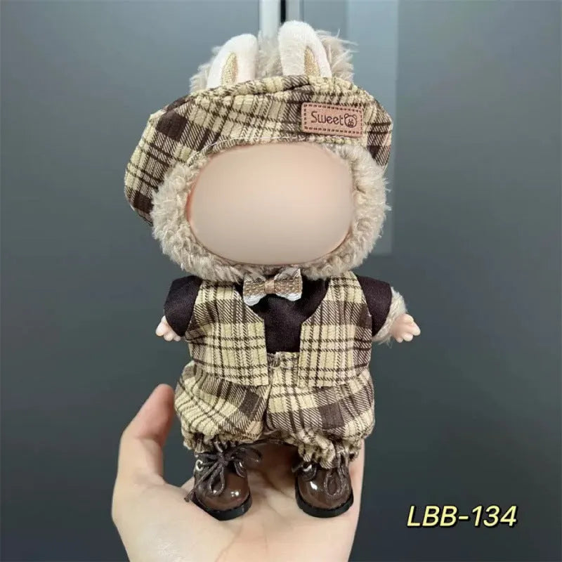 Plastic doll clothing costume for 17cm tall vinyl figurines on a display stand.
