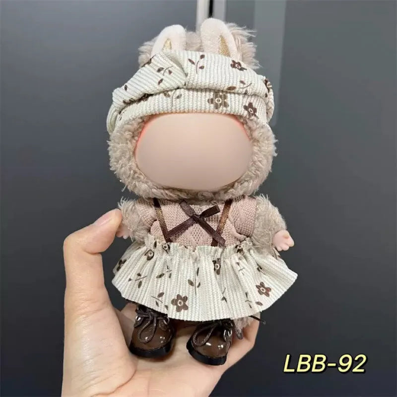 Plastic doll clothing costume for 17cm tall vinyl figurines on a display stand.