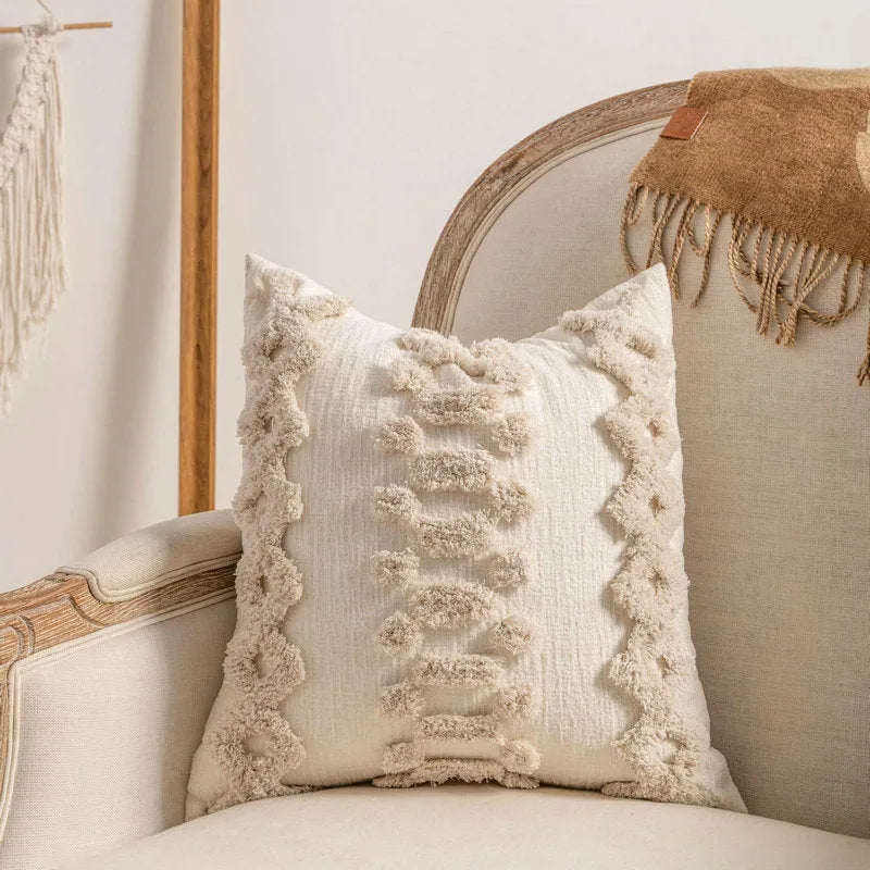 Knitted sofa cushion cover with tassel detail and striped pattern in spiral dots colour design