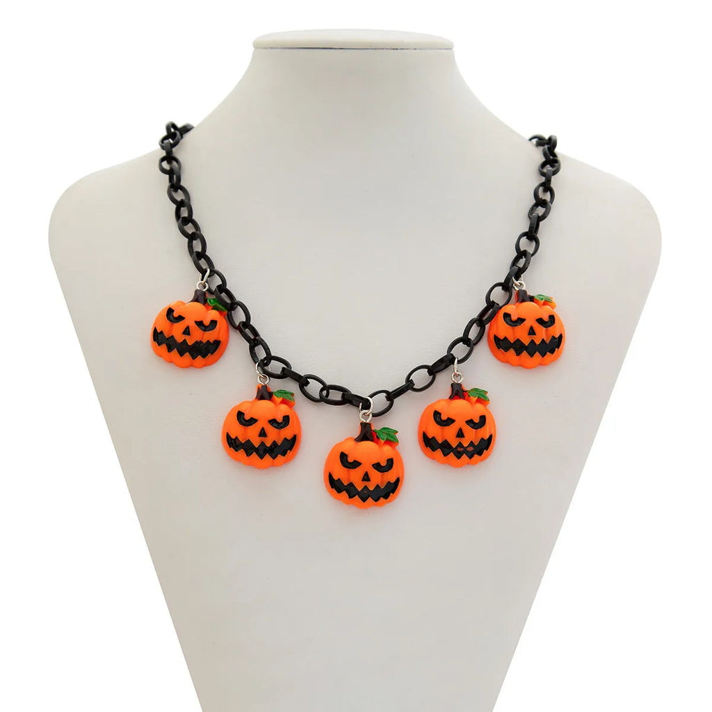 Halloween necklace with ghost and pumpkin cartoon pendants on a chain, in mixed colours.