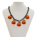 Halloween necklace with ghost and pumpkin cartoon pendants on a chain, in mixed colours.