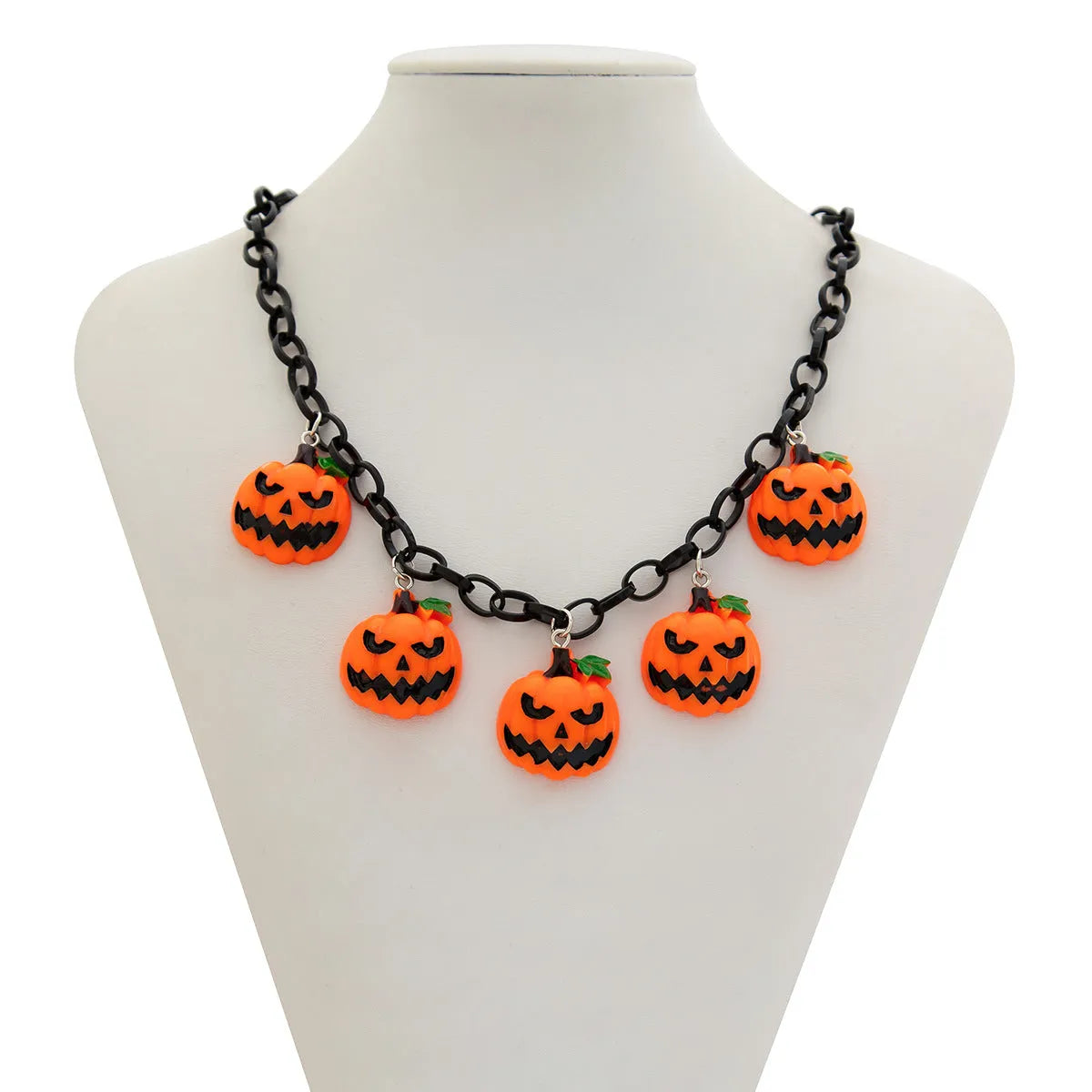 Halloween necklace with ghost and pumpkin cartoon pendants on a chain, in mixed colours.