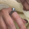 Geometric copper open band ring for women with a black pearl and adjustable opening.