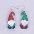 Pair of cartoon Santa Claus acrylic earrings in red and green hat style.