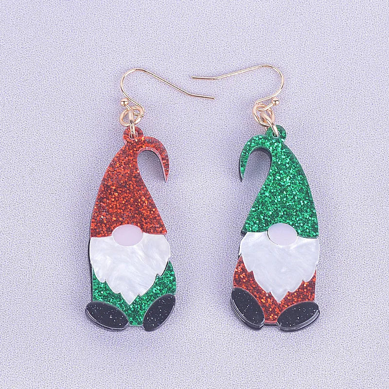 Pair of cartoon Santa Claus acrylic earrings in red and green hat style.