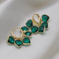 Pair of green heart-shaped pendant ear clips on a copper clip with Korean style design.