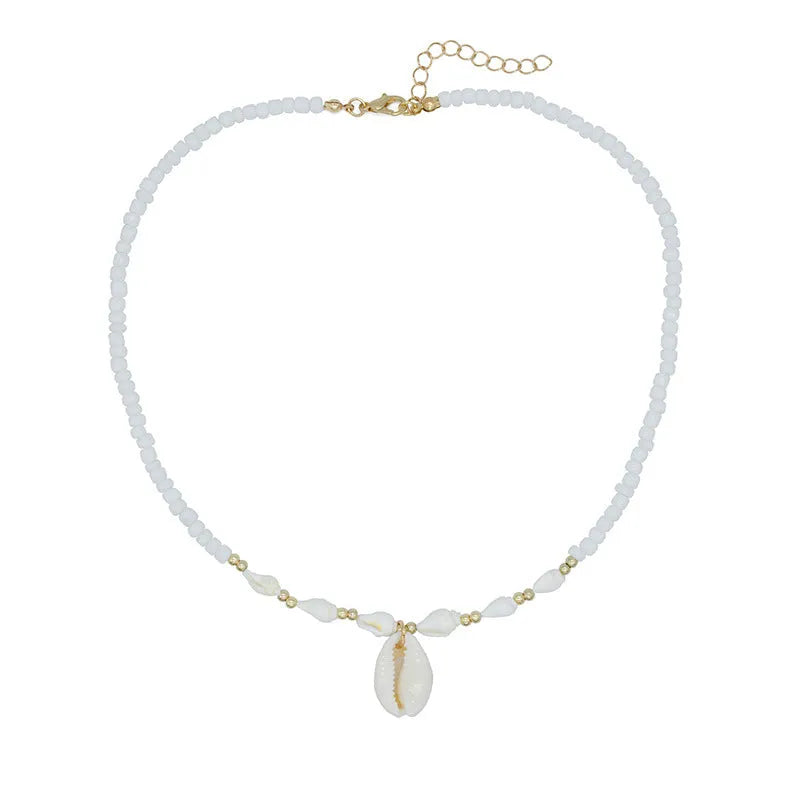 White conch shell pendant necklace on a regular chain, made from mother pearl shellfish.