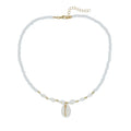 White conch shell pendant necklace on a regular chain, made from mother pearl shellfish.