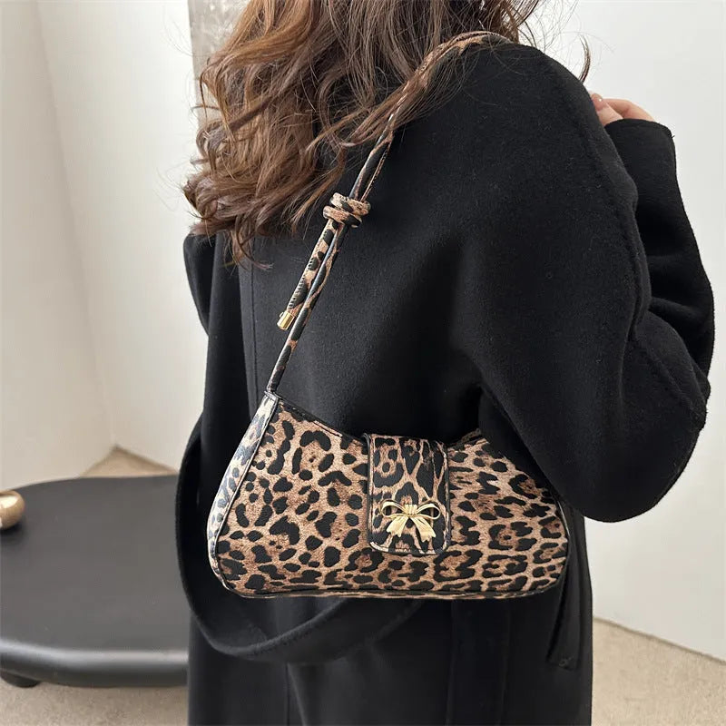 Women's large capacity casual PU handbag in black with sandwich pocket exterior design