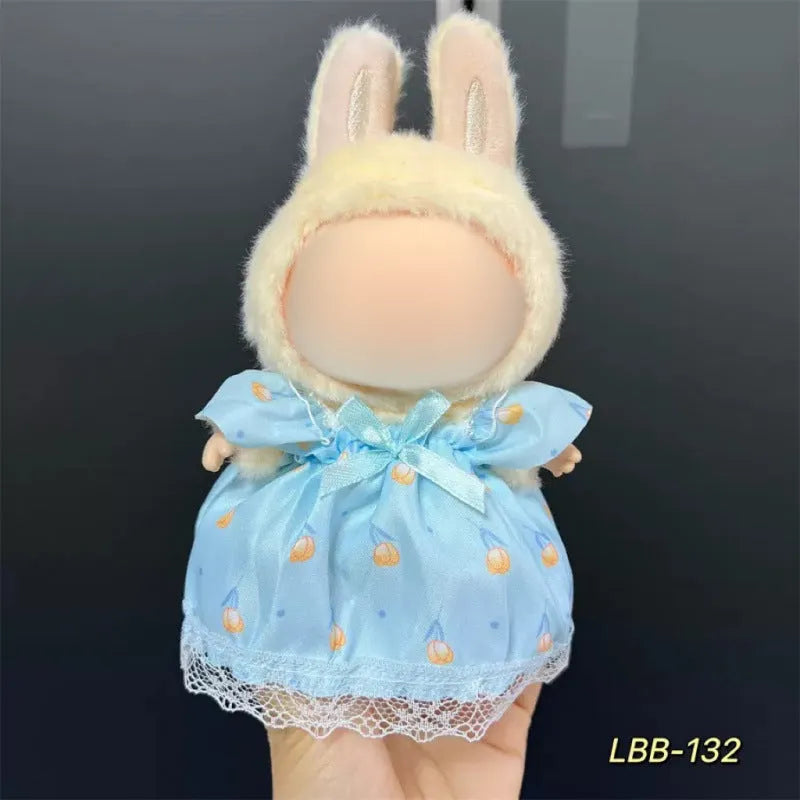 Plastic doll clothing costume for 17cm tall vinyl figurines on a display stand.