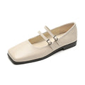 Women's silver leather Mary Jane flats with a cross buckle strap and flat sole.
