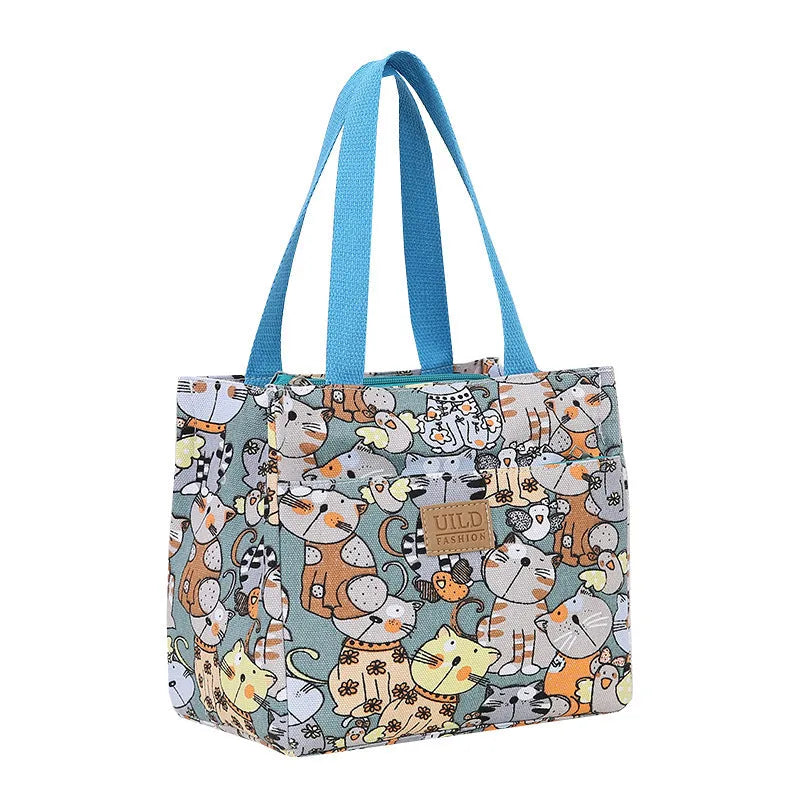 Women's printed canvas tote bag with aluminium frame showing horizontal square shape and floral pattern design