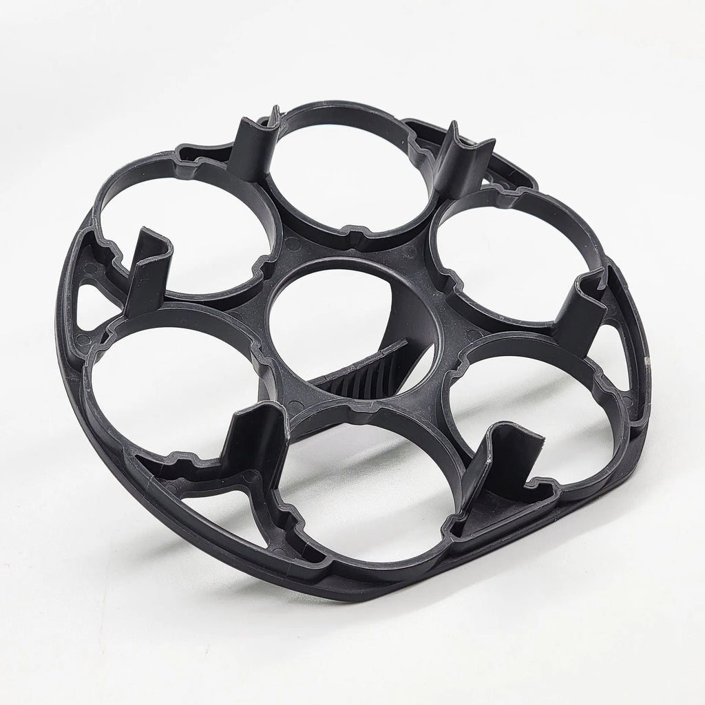 Black plastic egg holder basket for kitchen countertop storage.