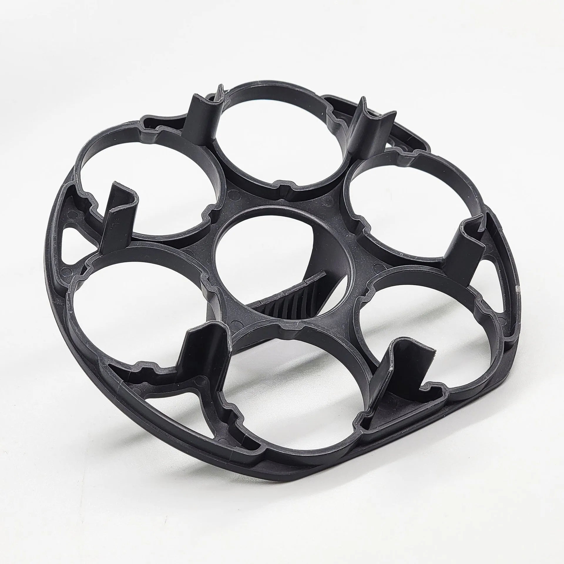 Black plastic egg holder basket for kitchen countertop storage.