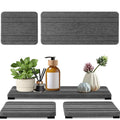 Three square diatom oil bathroom drying mats in solid colour on a countertop