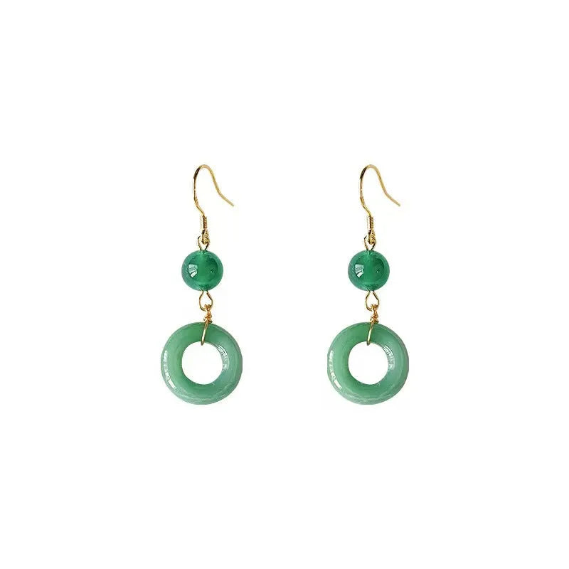 A pair of geometric green jade design Peace Buckle earrings in zinc alloy on a white background.